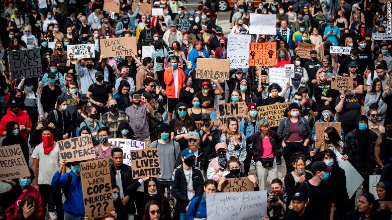 Thousands of people gather for a peaceful demonstration in support of George Floyd and Regis Korchinski-Paquet and protest against racism, injustice and police brutality, in Vancouver, on Sunday, May 31, 2020. (Darryl Dyck/The Canadian Press via AP)